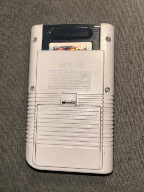 Front of classic gray Nintendo Game Boy Unit B displaying Frogger
