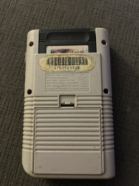 Front of classic gray Nintendo Game Boy Unit C displaying Frogger