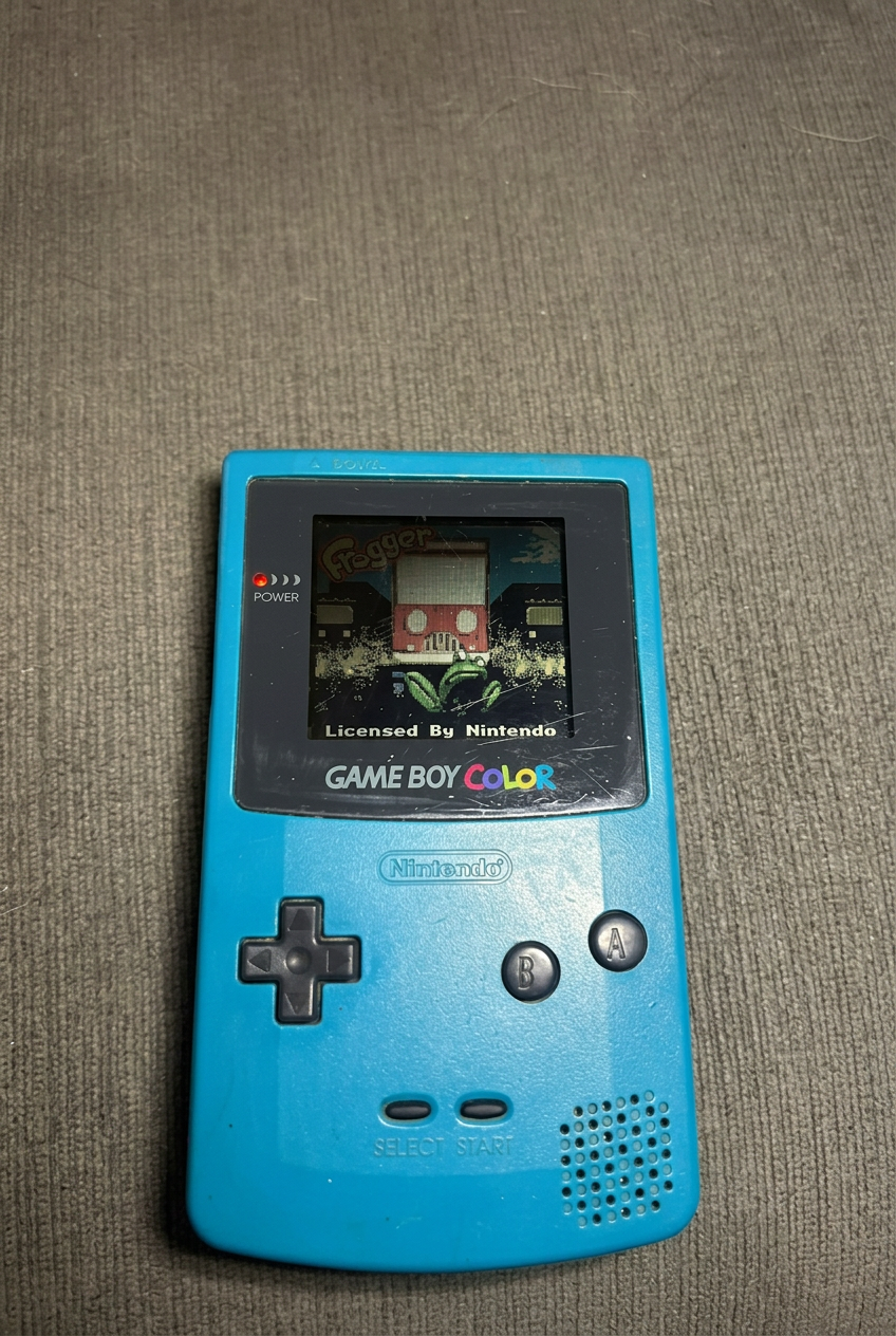 Teal Nintendo Game Boy Color powered on, cropped to exclude the white object